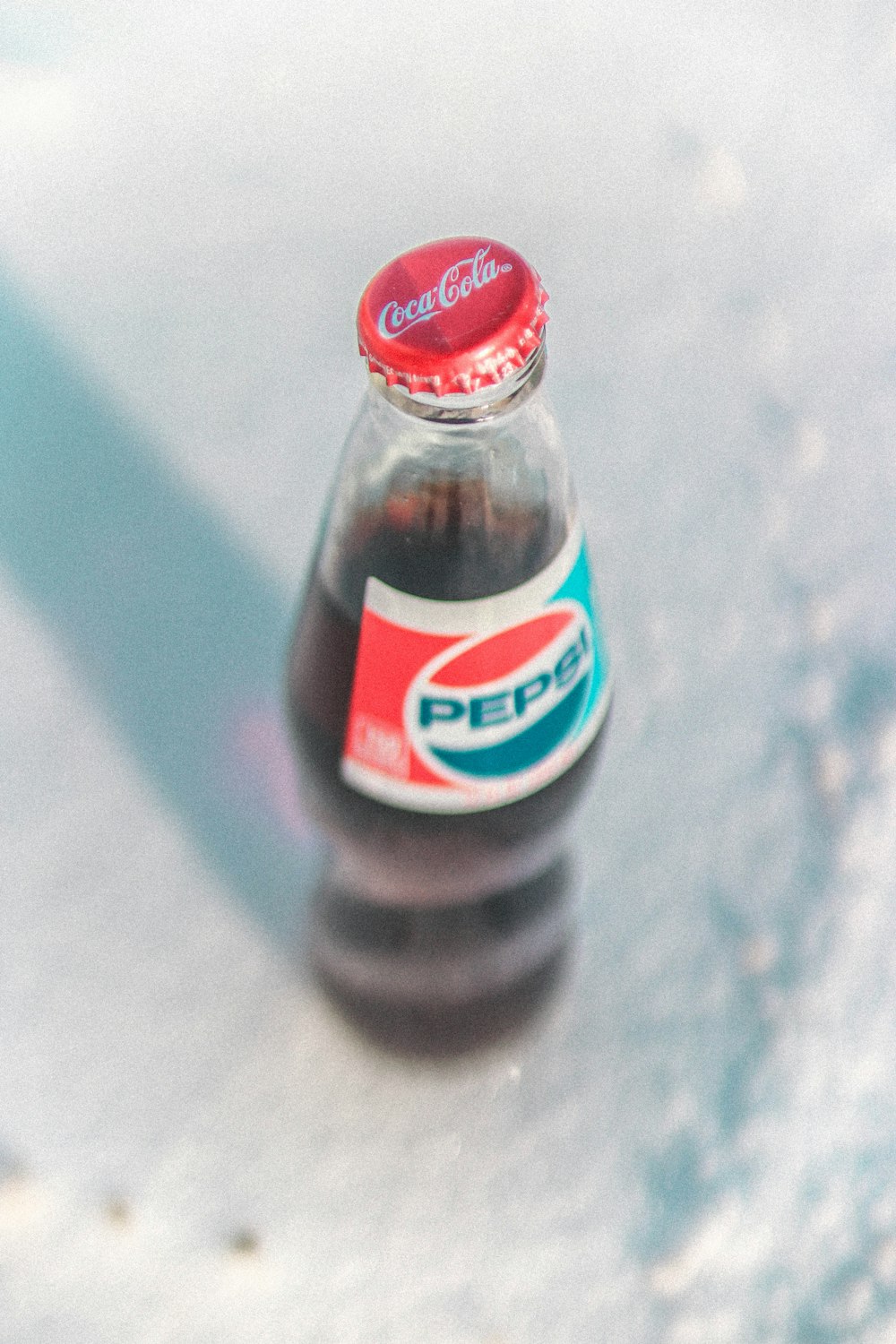 pepsi bottle with coca-cola cap
