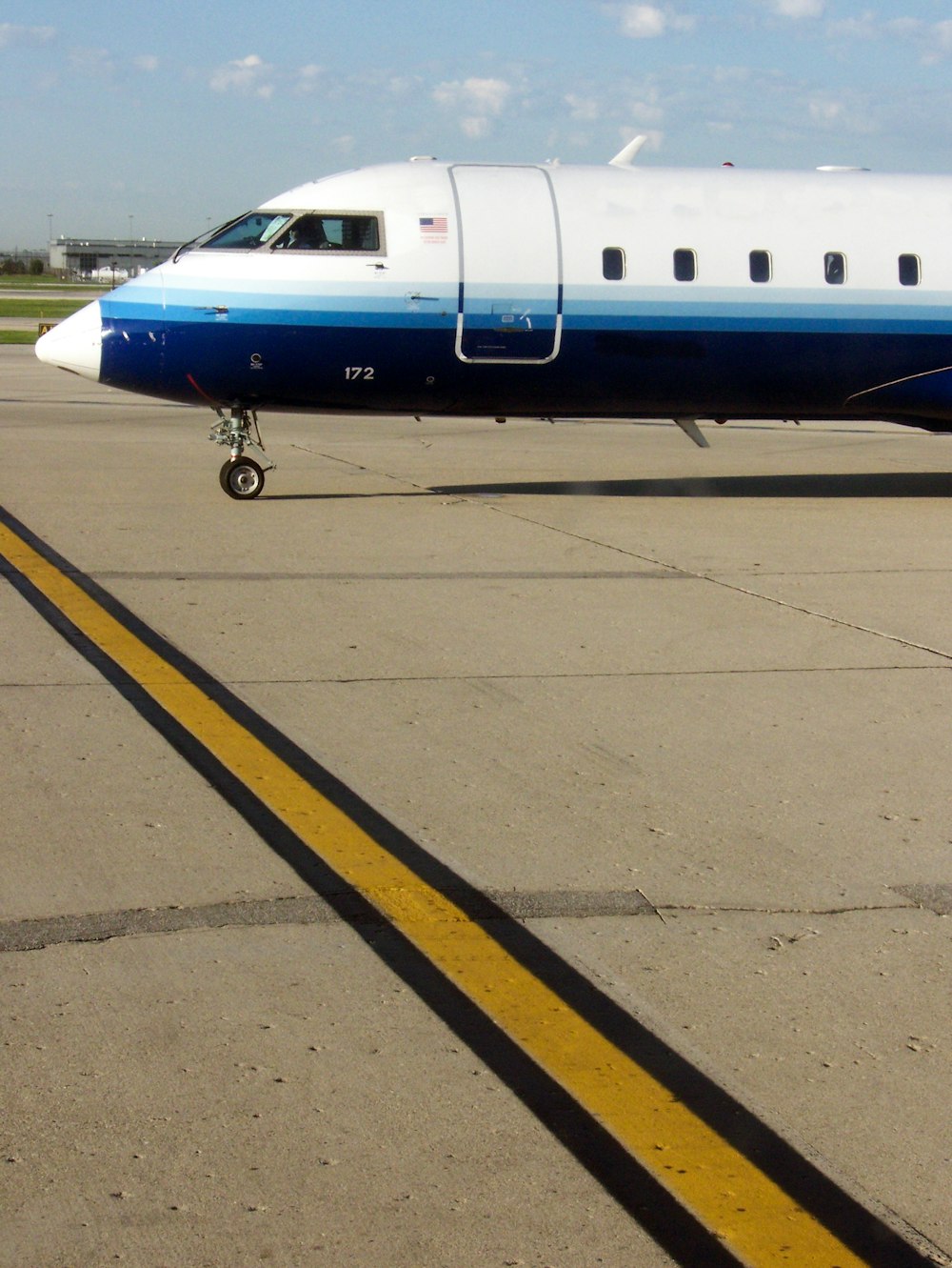 white and blue airliner