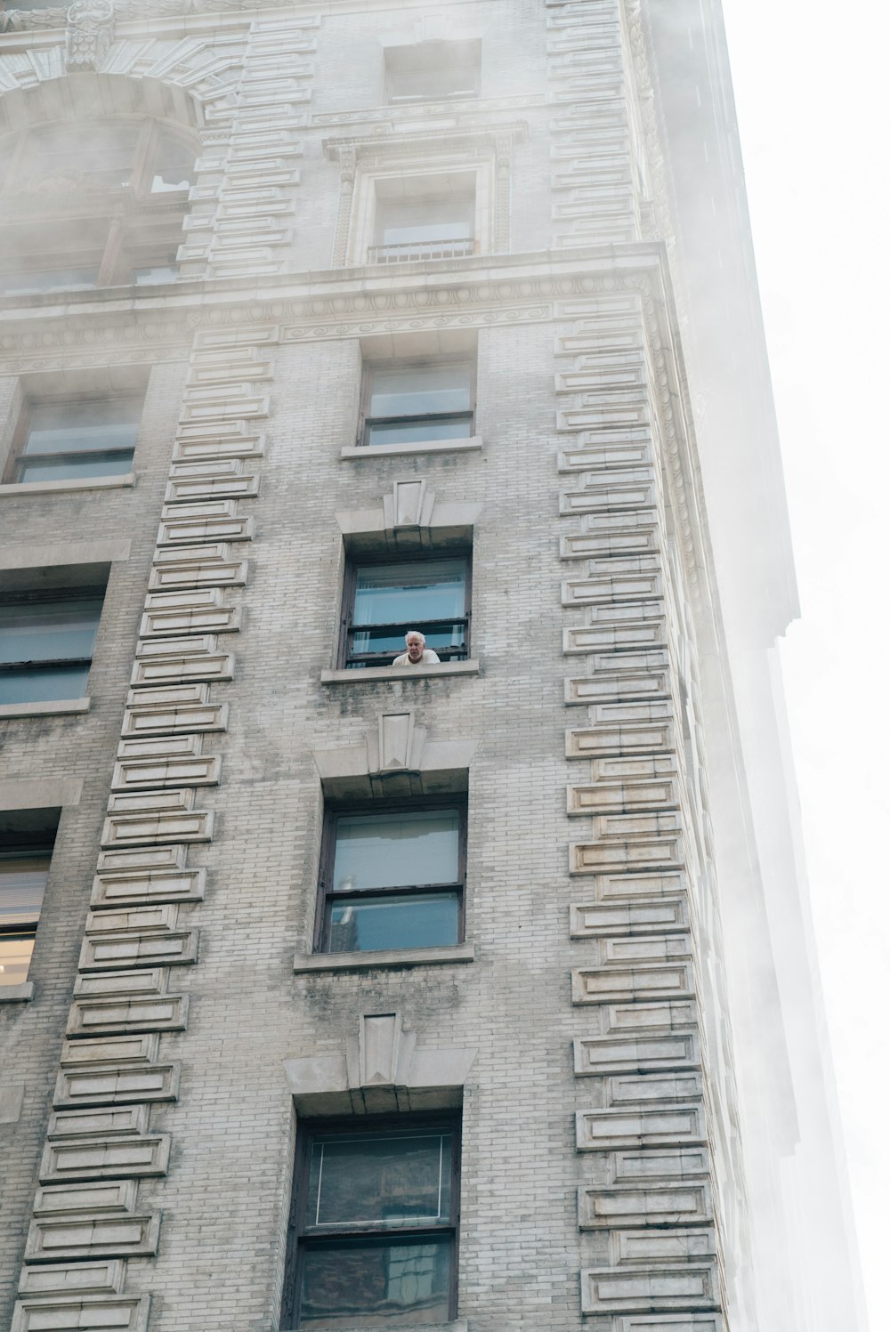 person looking at the window