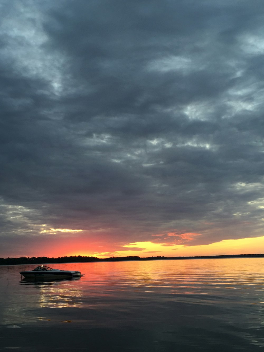 boat on body of water during golden hour