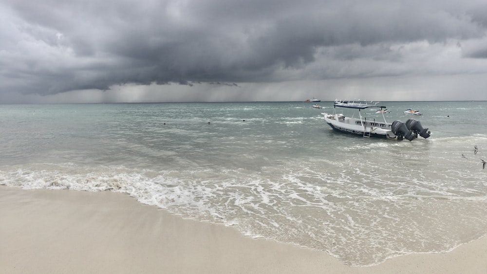 white boat on seashore