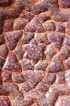 low-angle photography of red, blue, and teal floral ceiling