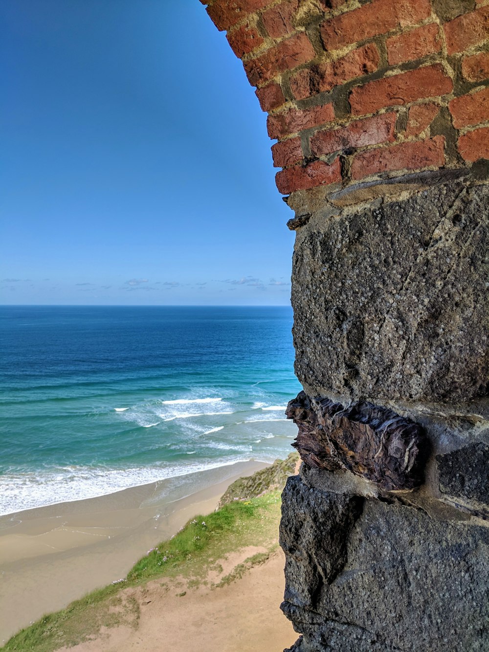 grey and brown brick wall in beach