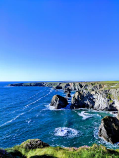 A crisp, detailed aerial panorama highlighting the rugged beauty of the Cromer cliffs and shoreline.