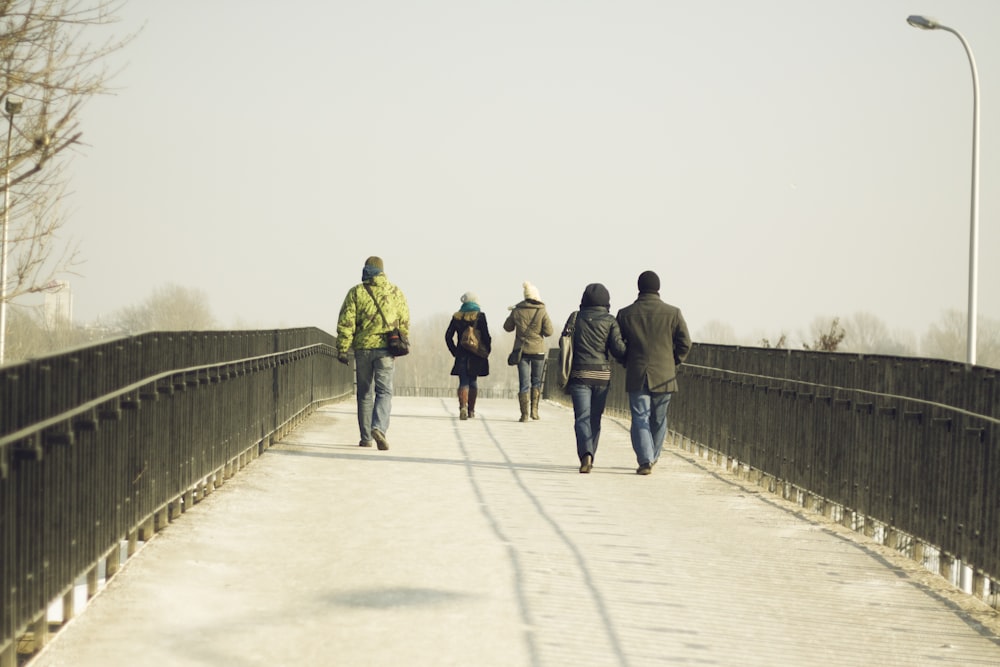 people walking on bridge