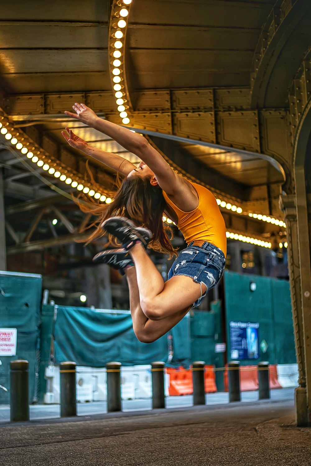 jumping woman under light