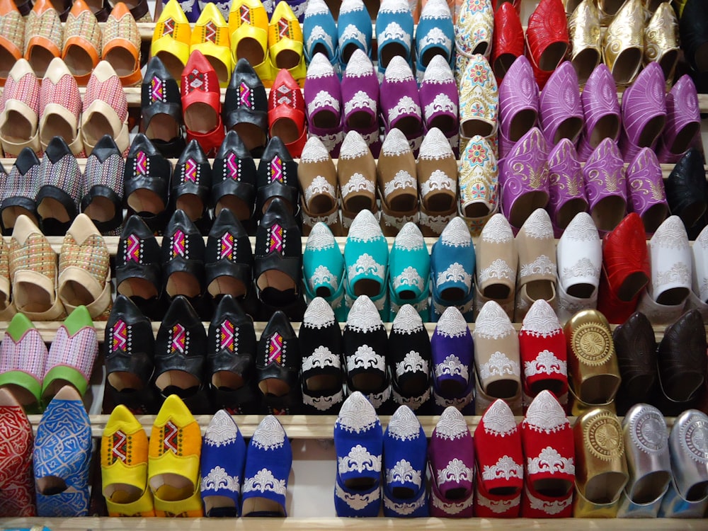 many pairs of shoes are on display in a store