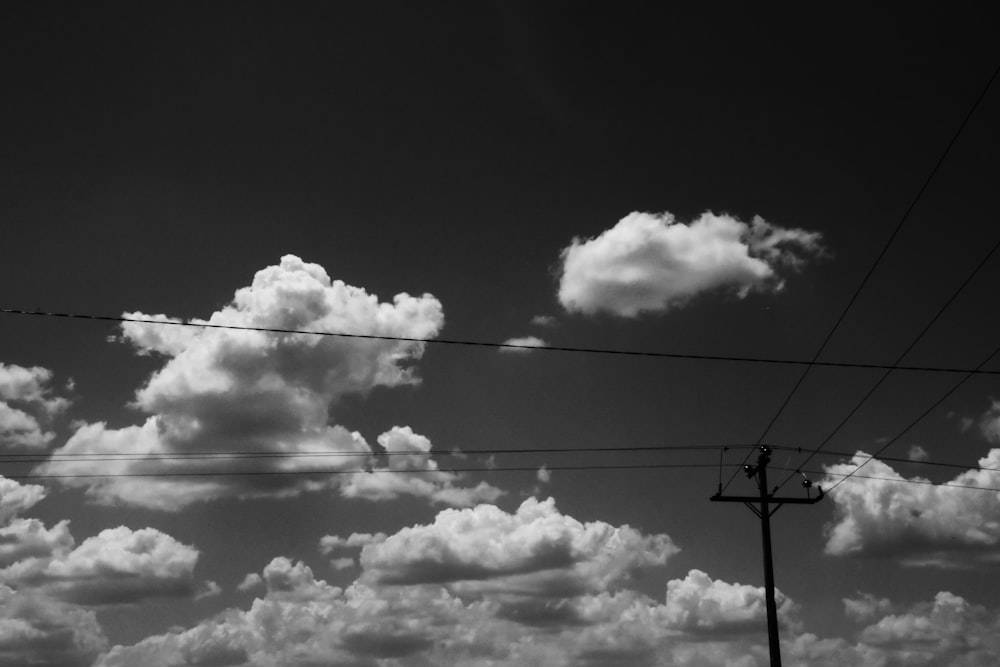 street post under cumulus clouds