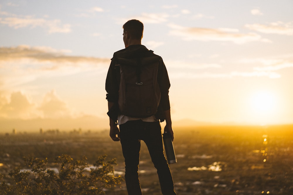 man standing near houses