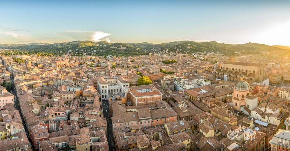 aerial photo of buildings near mountain during daytime