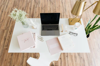 gray and black laptop computer on white table