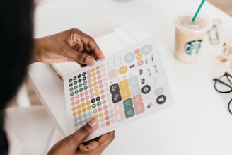 person holding white printing paper