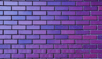 a close up of a purple brick wall