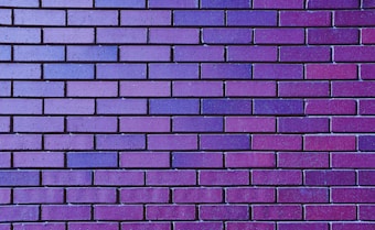 a close up of a purple brick wall