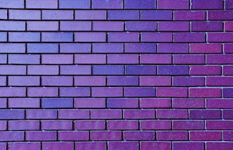 a close up of a purple brick wall