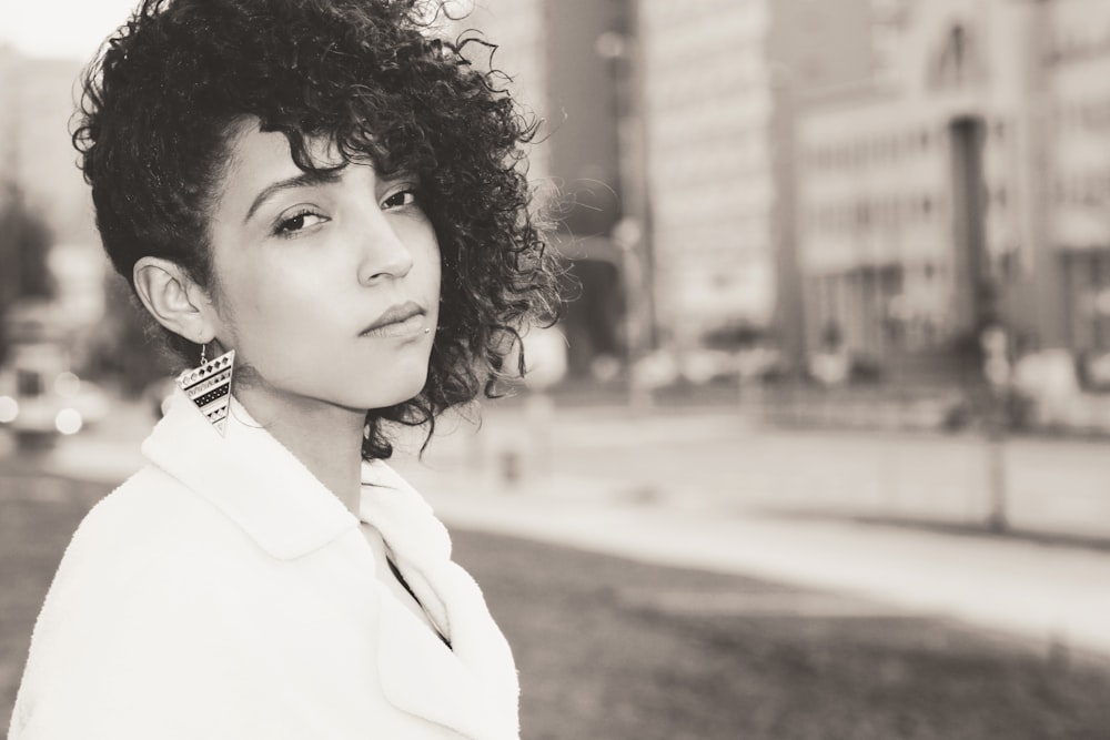 grayscale photography of woman wearing collard shirt