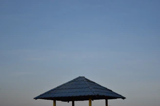 A sturdy steel gazebo in a backyard.