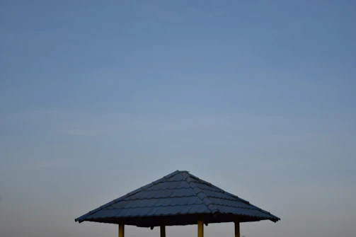 A sturdy steel gazebo in a backyard.