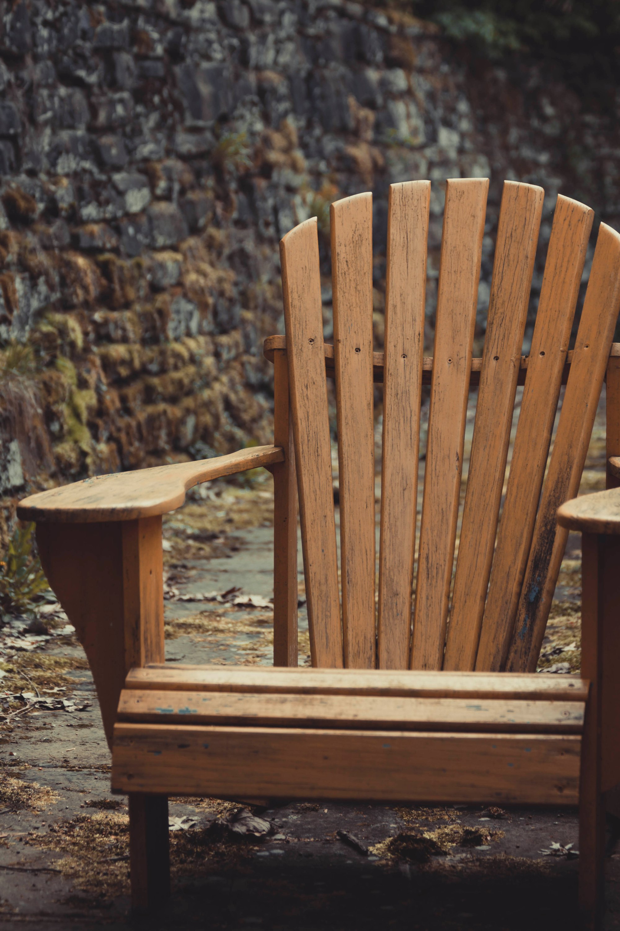 brown wooden Adirondack chair