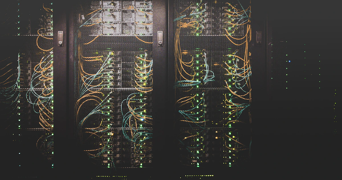 Operations engineer monitoring dashboards in a dimly lit network operations center