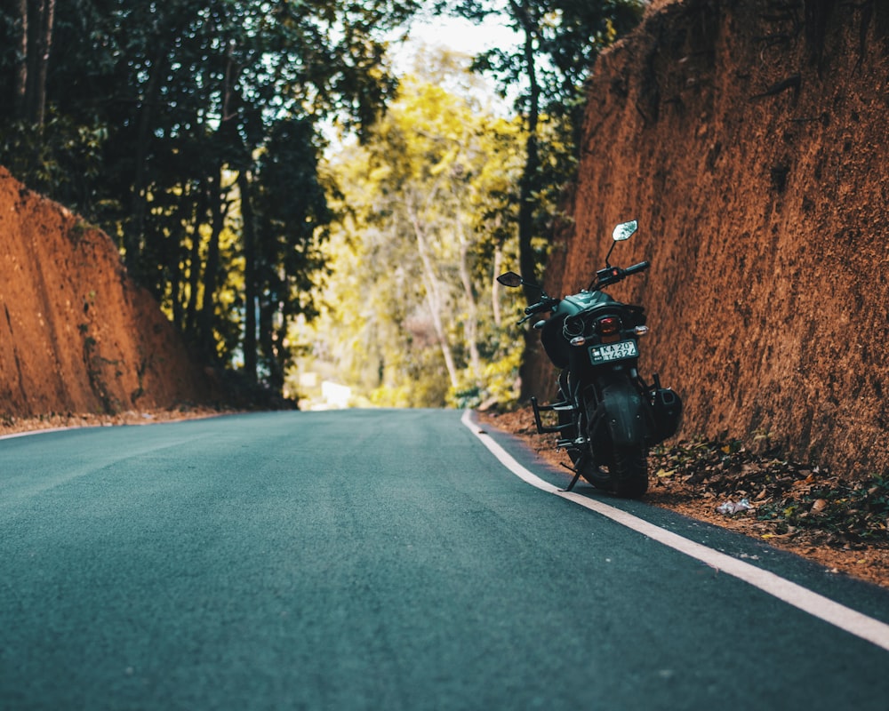 black sports bike in road during daytime