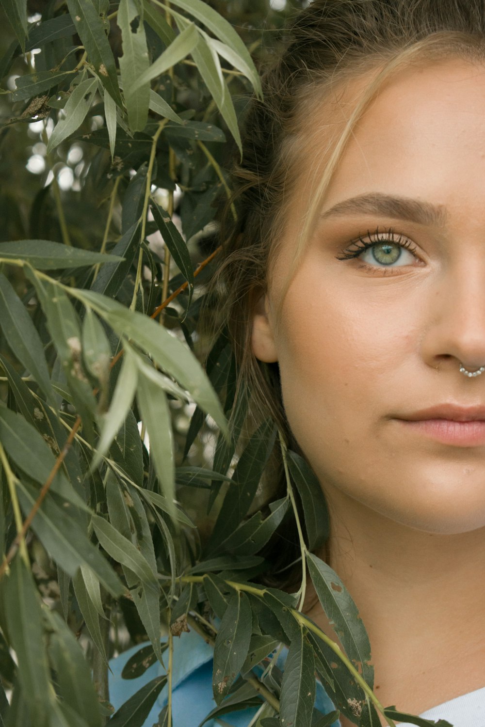 woman hiding from tree