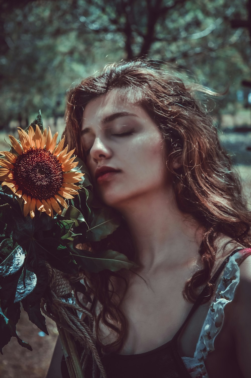 woman holding sunflower