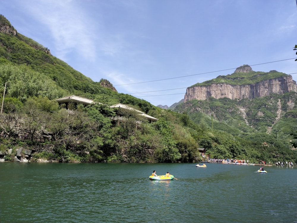 a body of water with a mountain in the background