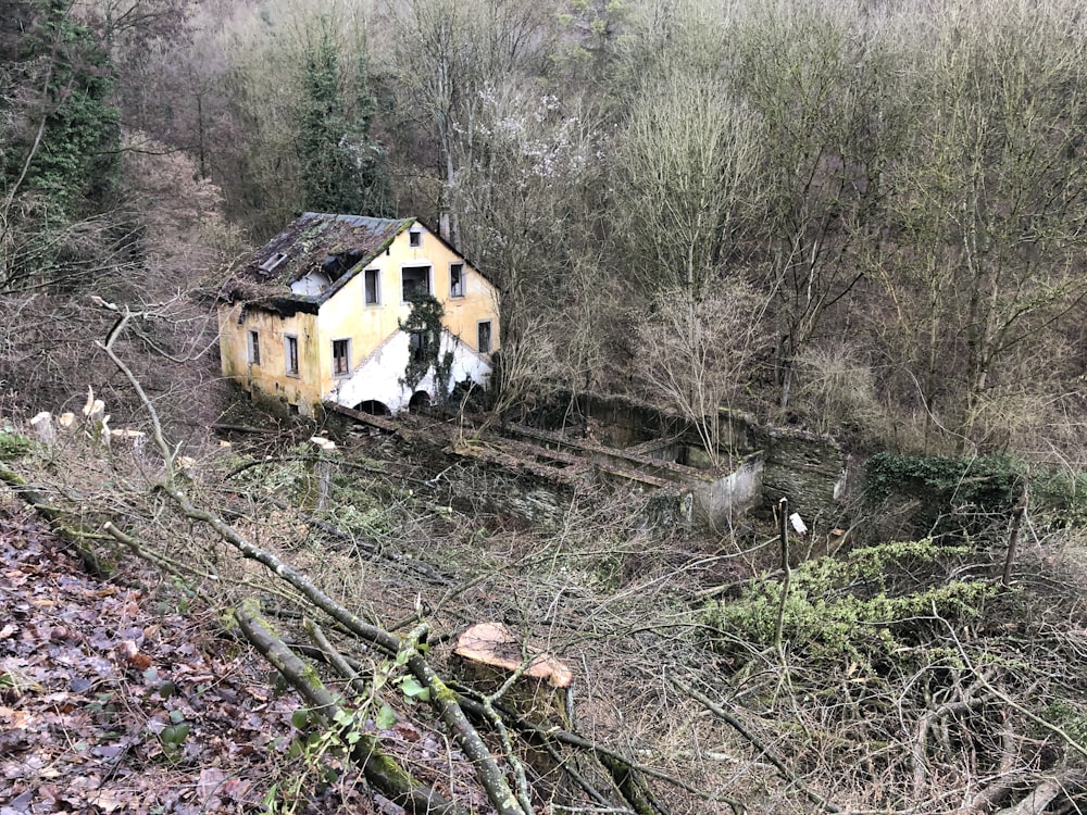 white painted house near trees during daytime