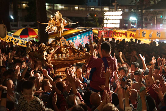 A vibrant event scene in Japan with people engaging and enjoying a Chinsu-sponsored gathering.