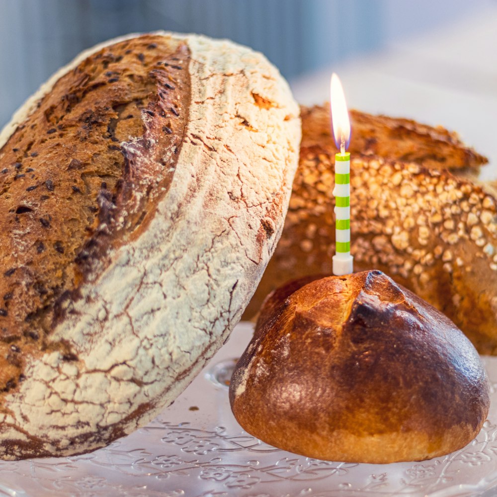 lighted candle on bread