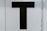 black letter T text