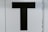 black letter T text