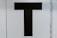 black letter T text