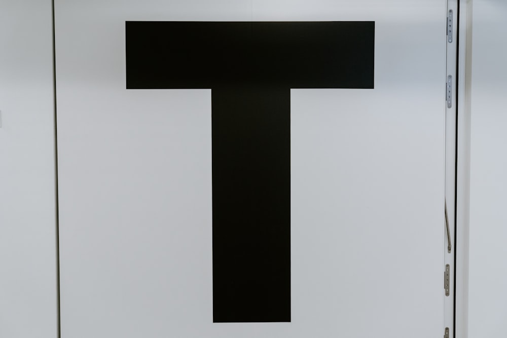black letter T text