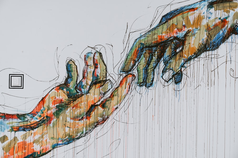 peinture de deux mains humaines