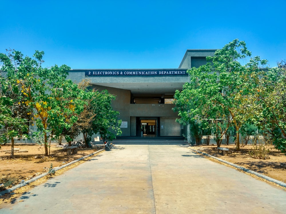 empty concrete road in front of concrete building