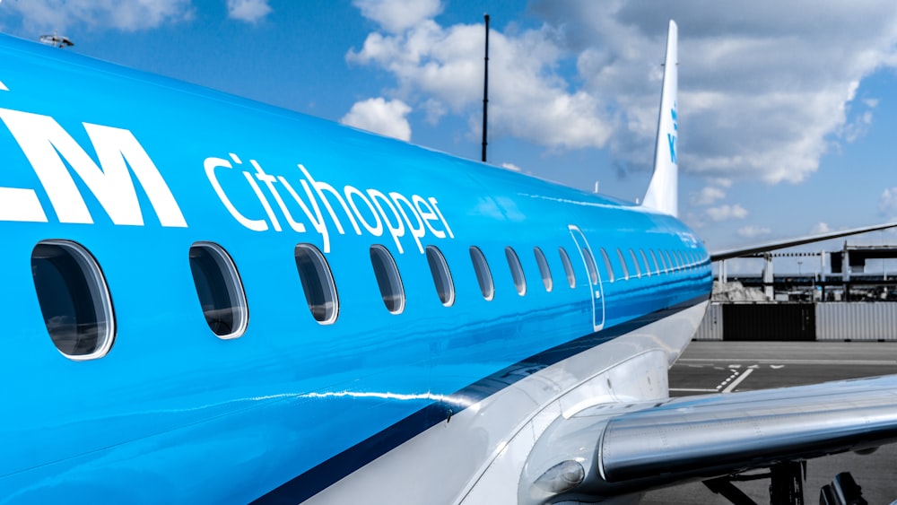 close-up photo of City Hopper plane on airport during daytime
