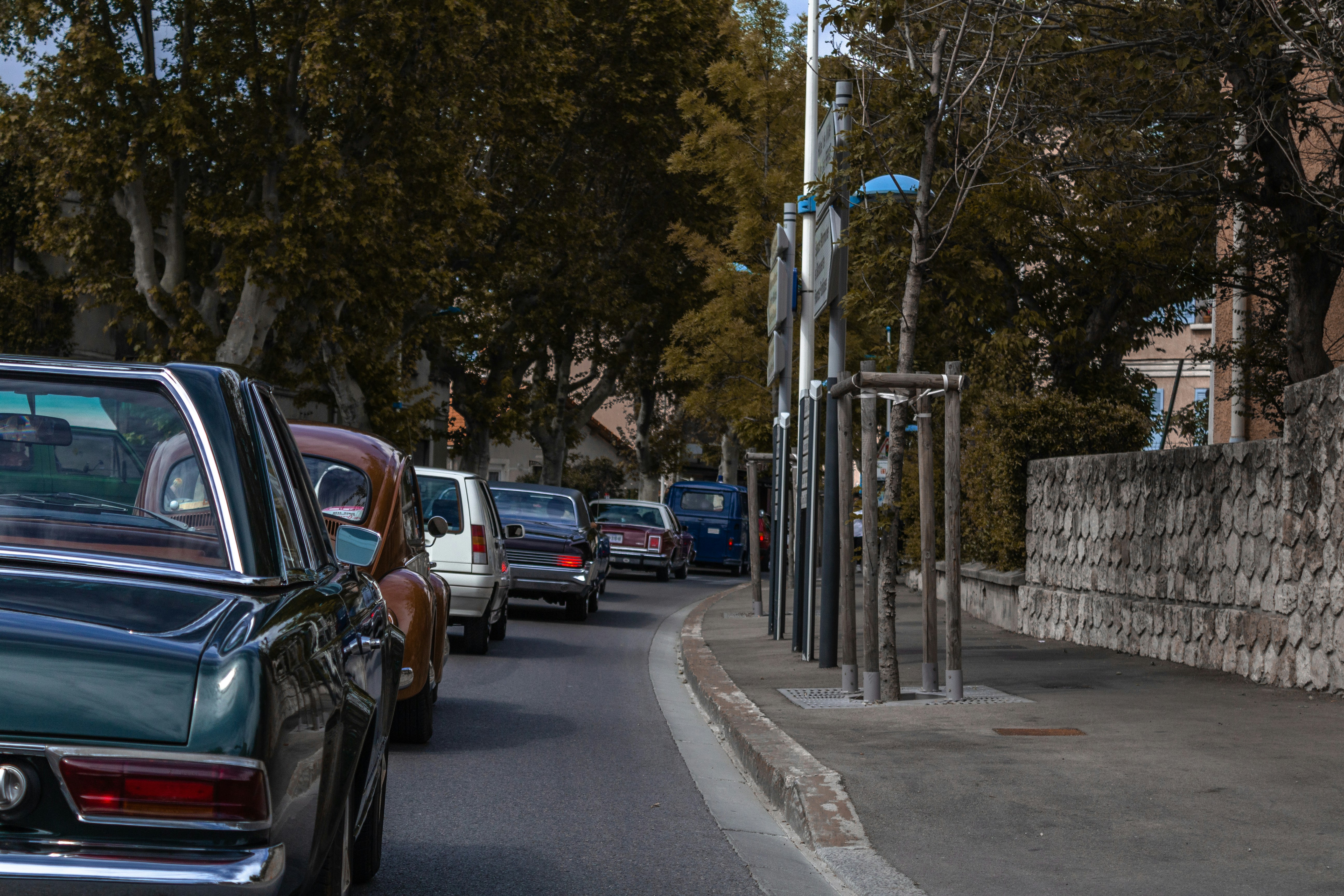 vehicles on road during daytime