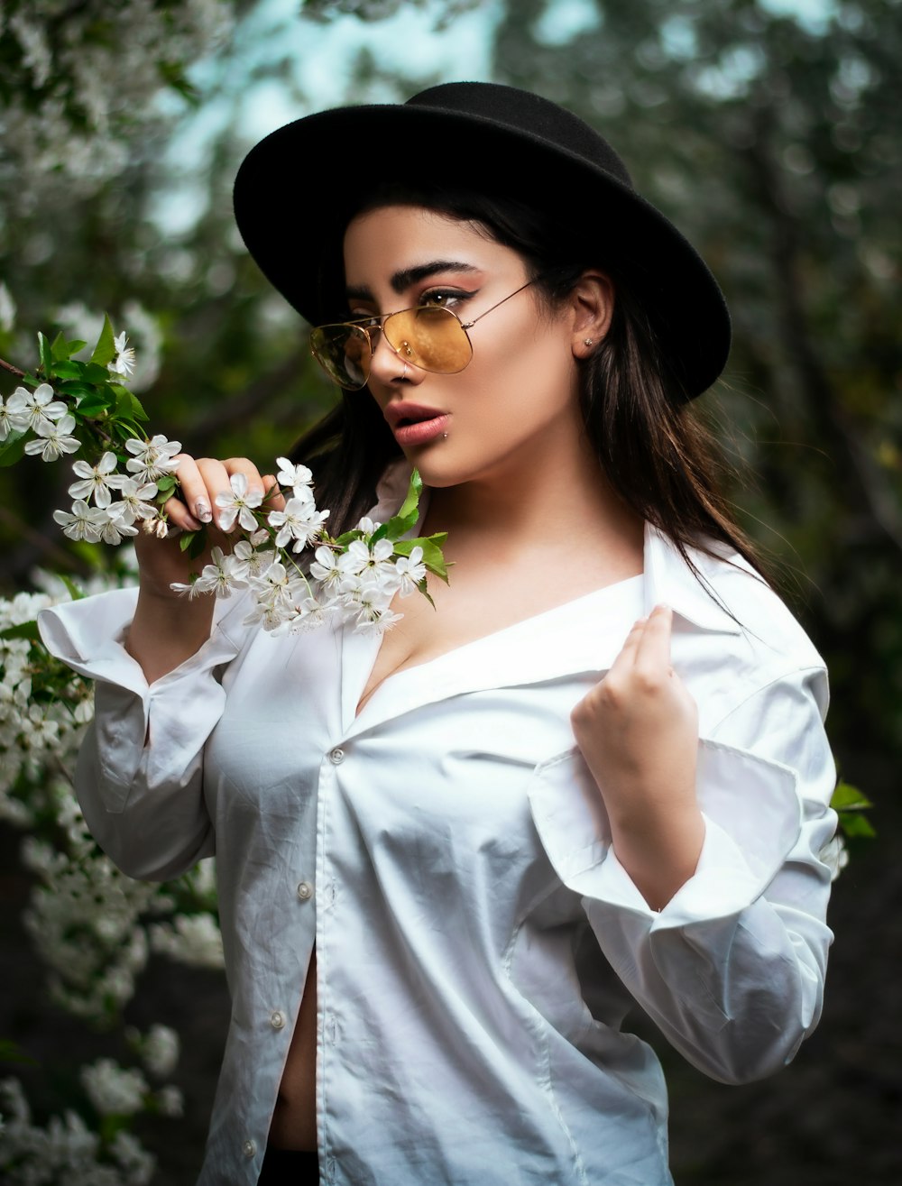 woman holding white flowers