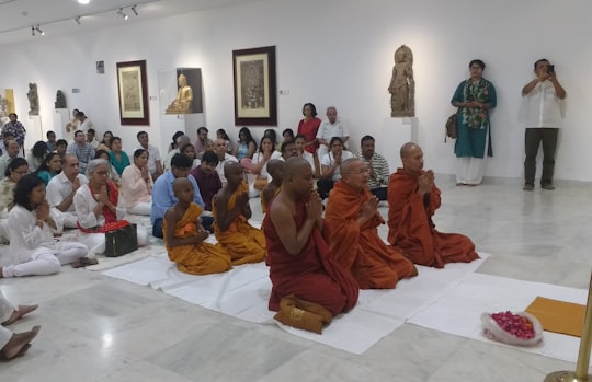 monk praying in Janpath India