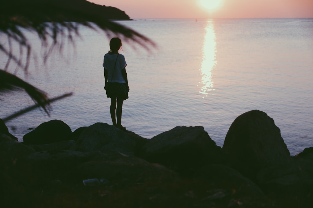 woman standing near ocean