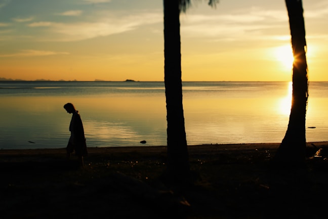 A peaceful beach scene at sunset reflecting the calm and sacred atmosphere of holisticcaribbean