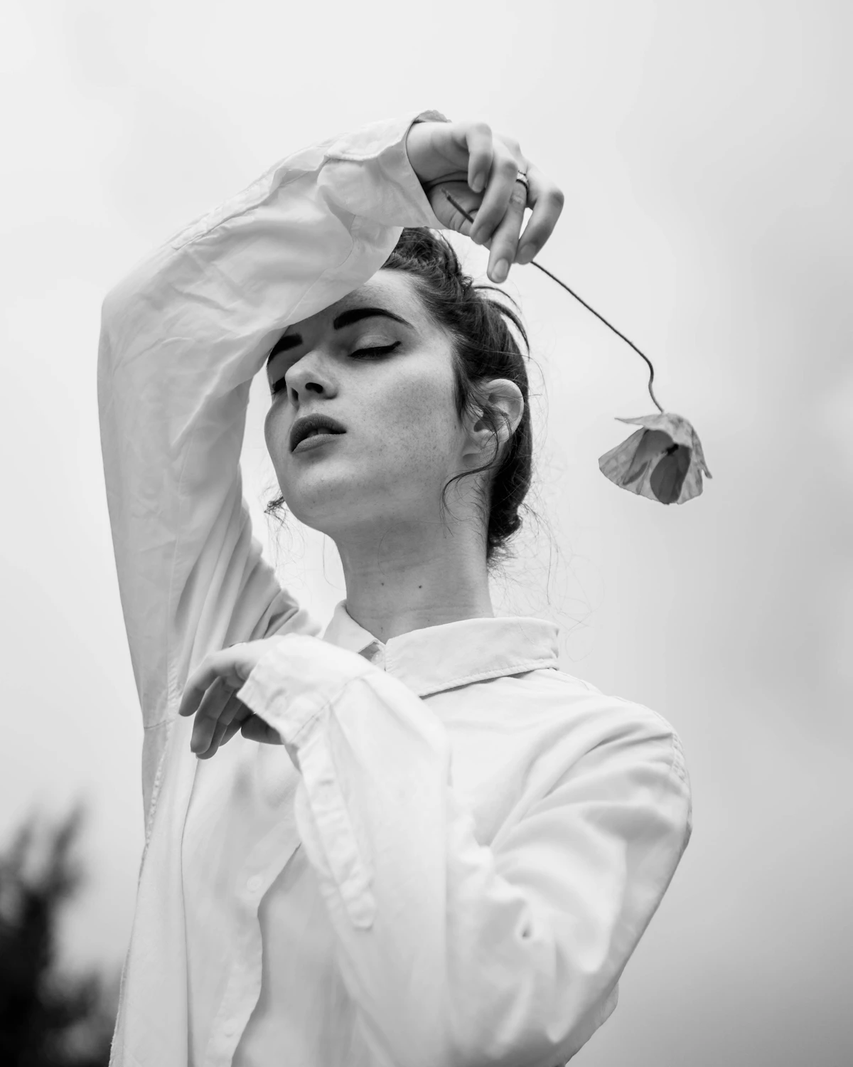 A woman in a perfectly cut classic white shirt