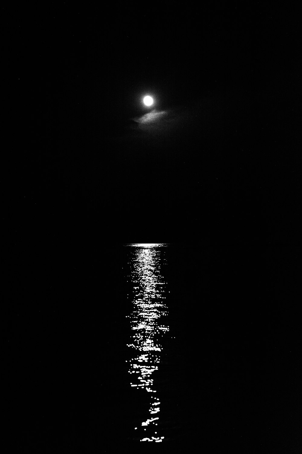moon above body of water