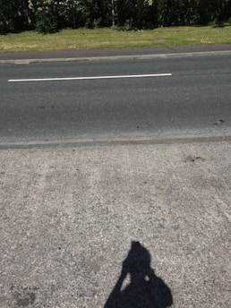 A freshly constructed sidewalk and driveway in front of a Bronx property.