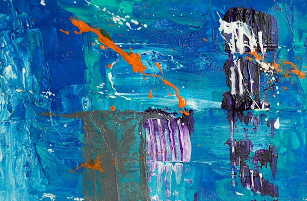 An abstract painting featuring bold strokes and splatters of vibrant blue, turquoise, and teal hues. Dynamic splashes of orange add contrast, while textured dark purple and white elements create depth and complexity.