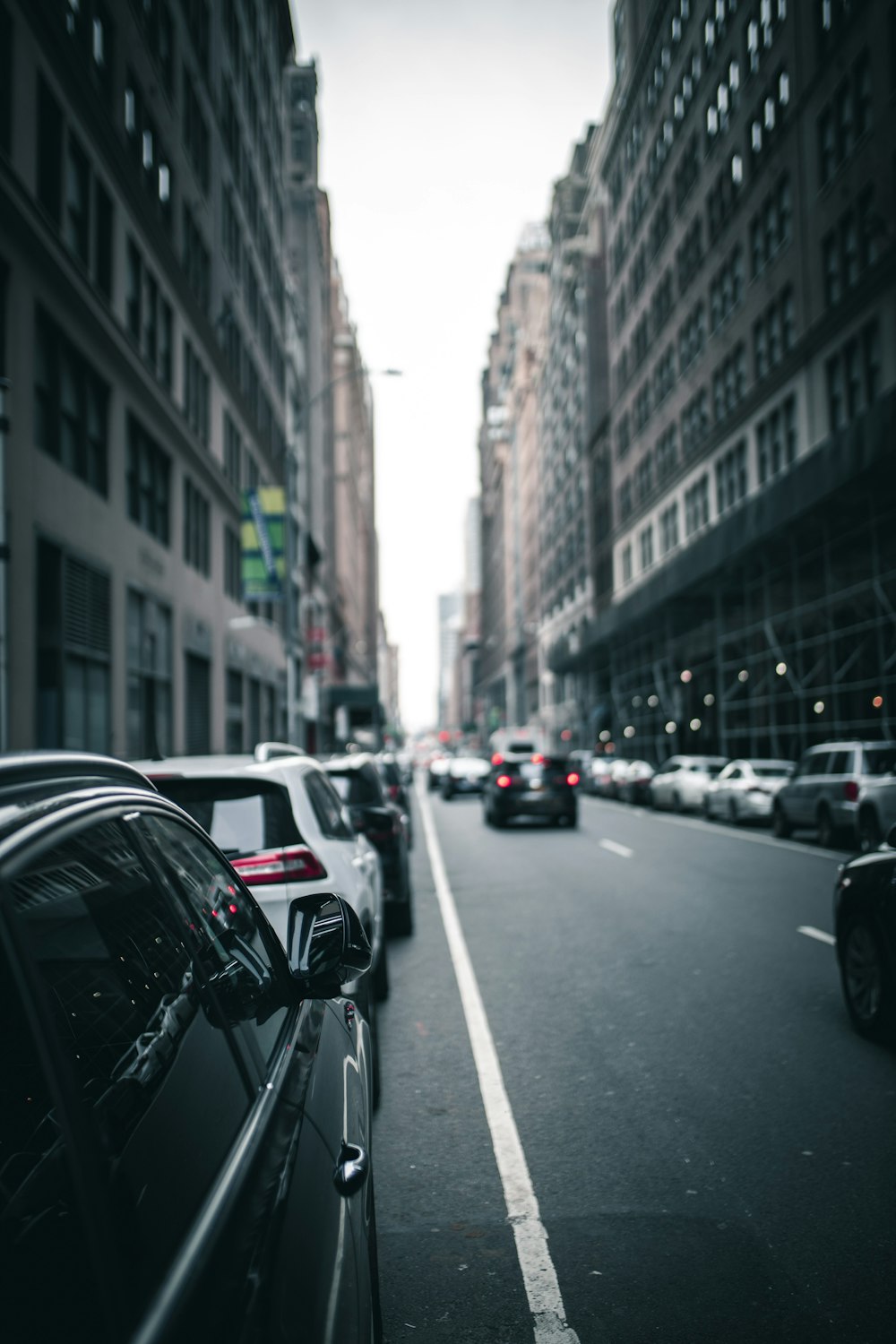 black vehicle parked beside buildings