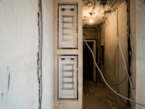 Electrician installing wiring in a newly renovated apartment.