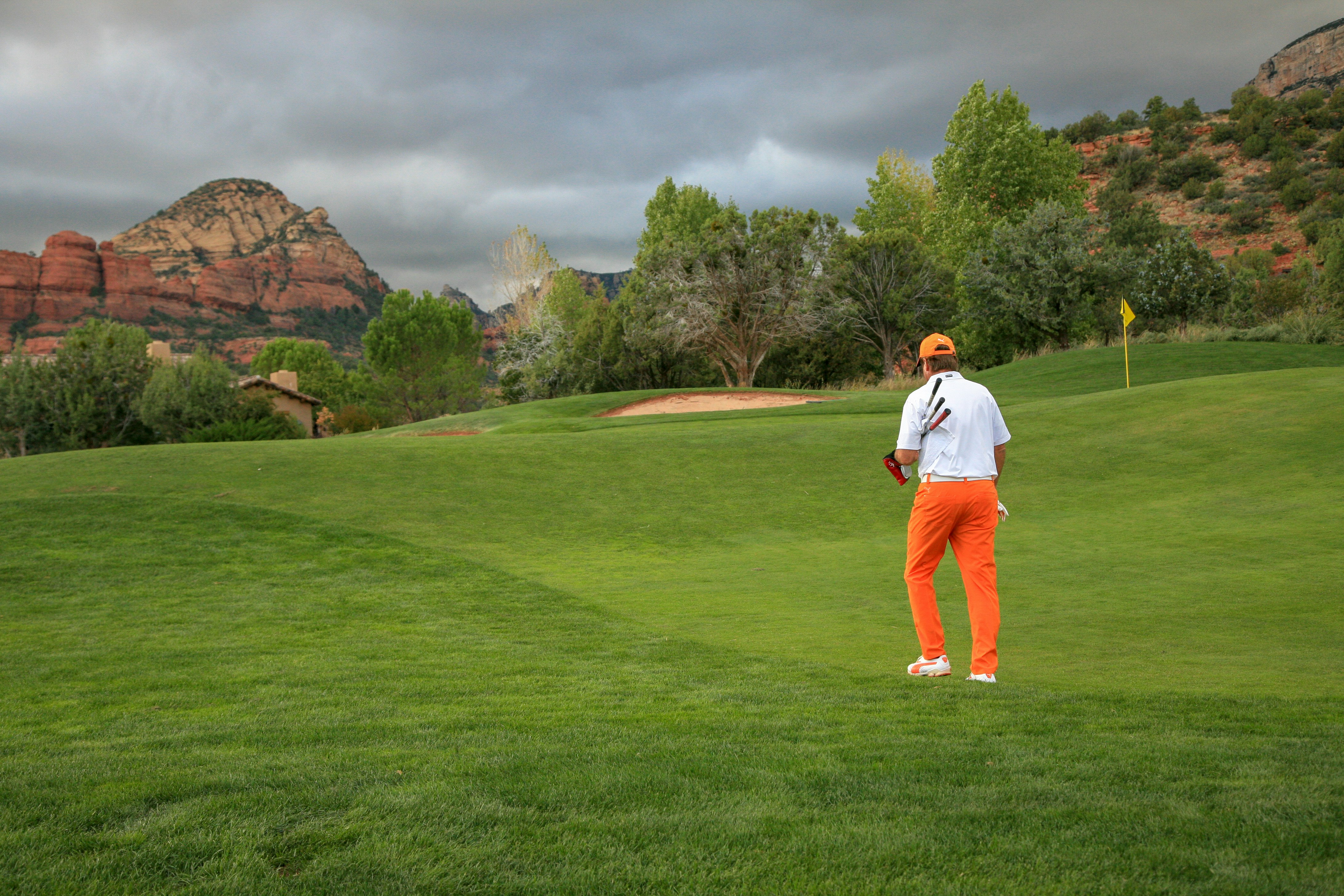 man playing golf in field
